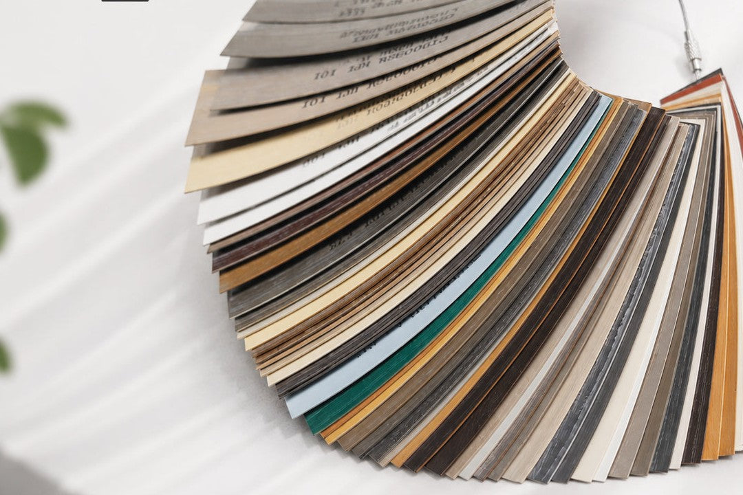 Fan deck of edge banding color samples in wood grain, solid and stone tones