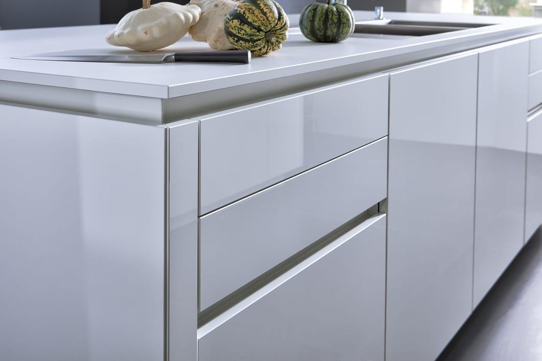 How do I make high-gloss cabinets look seamless?